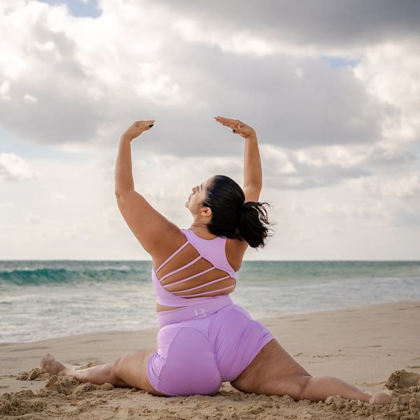 Person starting yoga journey with a purple accent theme.